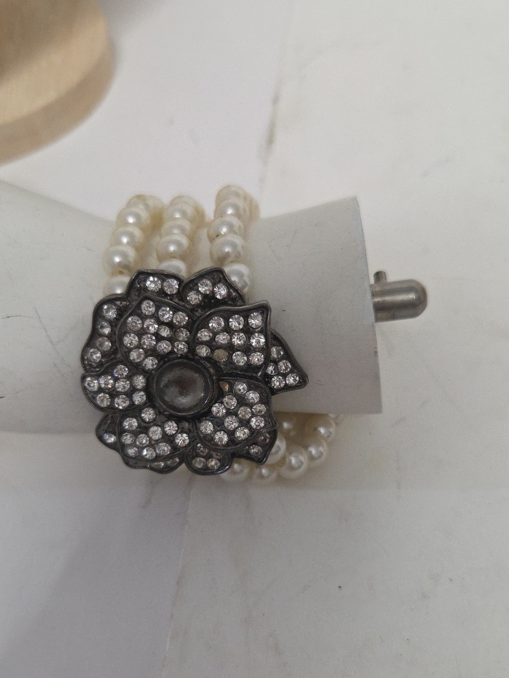 Hand Crafted White Pearl Triple-Strand Bracelet with Crystal Flower